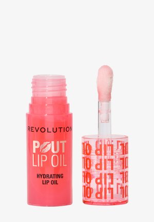 Rosa lip oil i et cylindrisk rør med en klar applikator med en blød, fluffy spids. Tuben er mærket med fed, rød tekst.