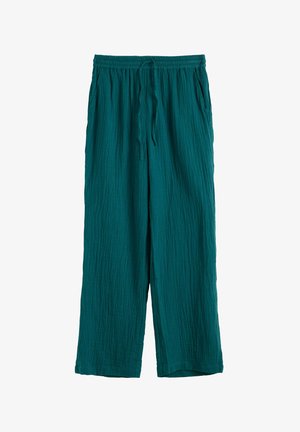Teal loose-fit pants with elastic waistband, front drawstring, side pockets, and textured fabric.