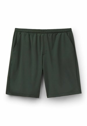 Dunkelgrüne Shorts mit elastischem Bund und Seitentaschen, knielang, aus glattem, leichtem Stoff vor weißem Hintergrund.