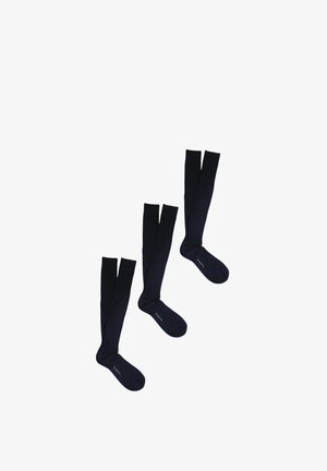 Tre paia di calzini neri al ginocchio con design a punta divisa e testo "PERODIL" nell'area del piede su sfondo bianco.