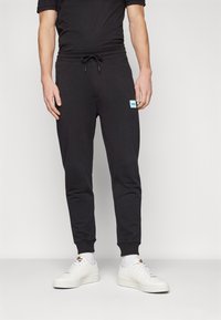 HUGO DOAK - Pantaloni de trening - black