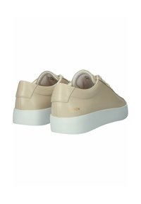 Beige leather sneakers with a smooth texture, featuring a white rubber sole, round toe, and subtle brand detail in gold on the side.