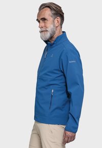 Blaues Windbreaker-Jacket mit Stehkragen, Reißverschlusstaschen und glatter Textur. Verfügt über ein Logo auf der Brust und eine leicht taillierte Passform.