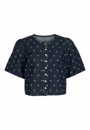 Top corto de mezclilla en azul oscuro con lunares azul claro. Presenta mangas cortas abullonadas y cierre frontal con botones plateados.