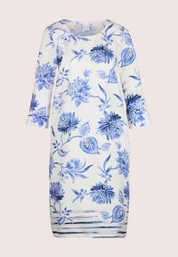 Blumendruckkleid in Weiß mit blauen Mustern. Hat einen runden Ausschnitt, Dreiviertelärmel und einen geraden Schnitt. Weicher Stoff.