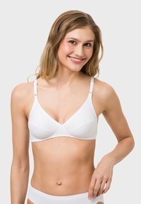 White triangle bra made of soft fabric, featuring adjustable straps, scalloped edges, and a seamless design, paired with a matching brief.