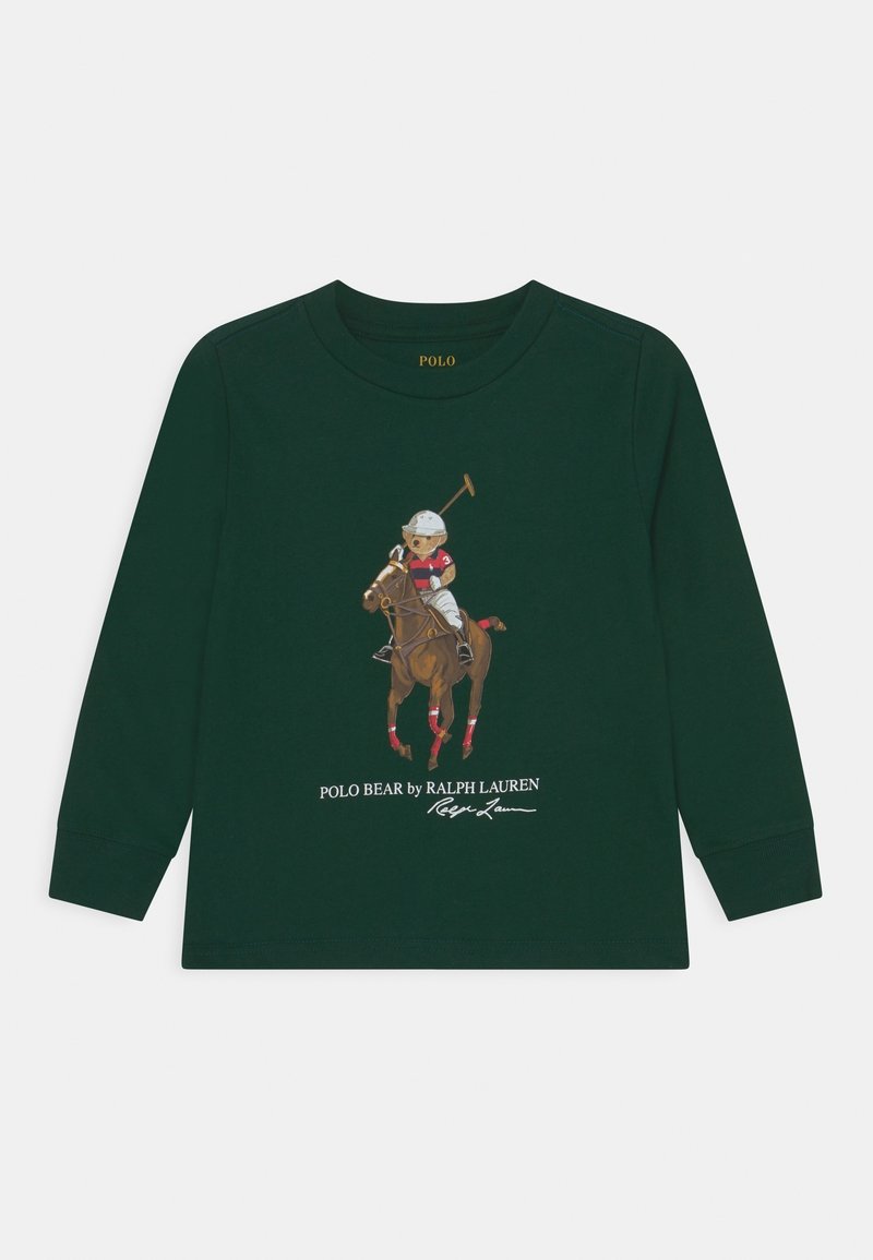 Green long-sleeve shirt featuring a polo bear graphic riding a horse, with red accents and the text “POLO BEAR by RALPH LAUREN” below.