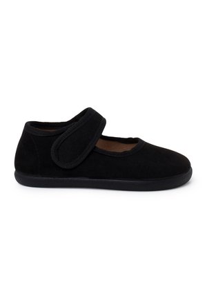 Chaussure Mary Jane noire avec une large bride en Velcro et une semelle plate, conçue pour une fixation facile et un port confortable.