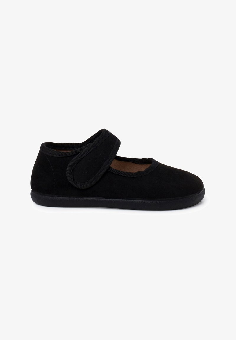 Chaussure Mary Jane noire avec une large bride en Velcro et une semelle plate, conçue pour une fixation facile et un port confortable.