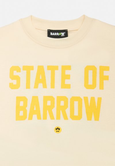 Sweatshirt de algodão creme com um grande e ousado texto amarelo a dizer "STATE OF BARROW" e um pequeno logotipo gráfico preto abaixo.