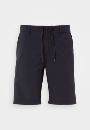 Tumed lühikesed püksid, mis on valmistatud tekstureeritud kangast, elastse vöökoha ja nööriga, sirge lõikega ja ilma lisa mustriteta.