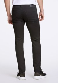 Junk De Luxe STAY - Slim fit jeans - black