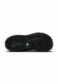 Black rubber outsole with textured tread pattern; features a green triangle accent near the center for traction and stability.