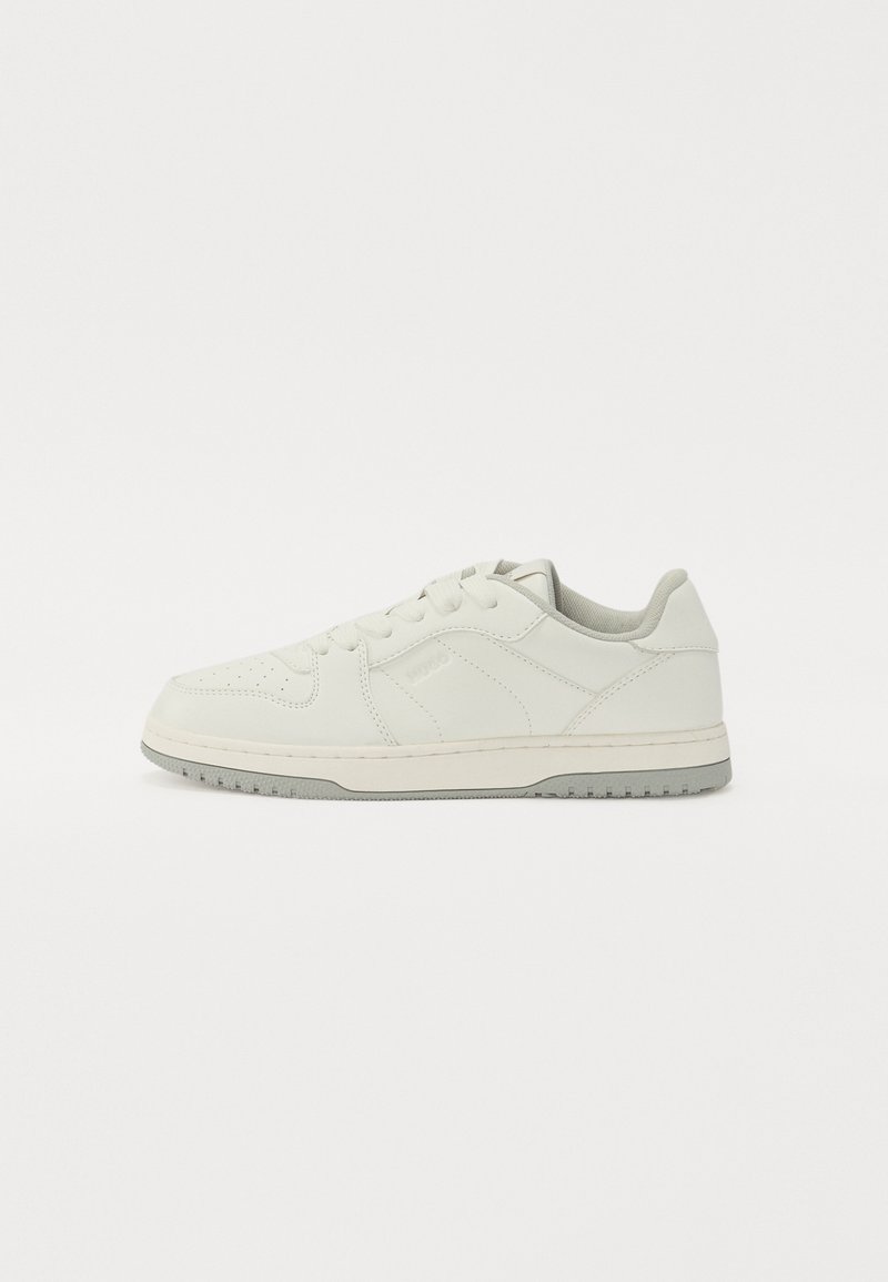 White leather sneaker with a smooth texture, rounded toe, flat laces, and a light grey rubber sole. Subtle embossed detailing on the sides.