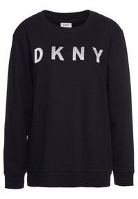 Black long-sleeve sweatshirt with white embroidered DKNY logo across the chest and ribbed cuffs and hem.