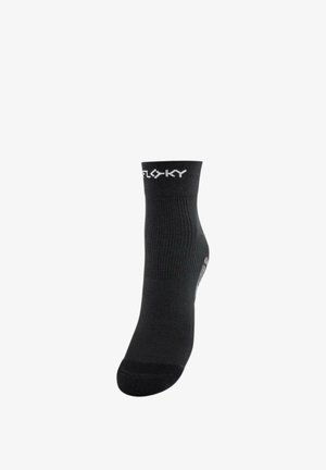 Chaussette cheville noire avec texture côtelée et texte de logo blanc près du bord supérieur sur fond blanc.