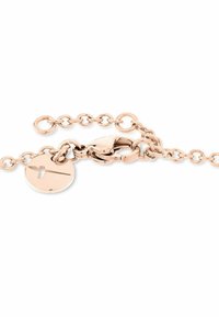 Rose gold chain bracelet featuring a clasp and a round charm with a line design. The links are uniform and textured, creating a delicate appearance.