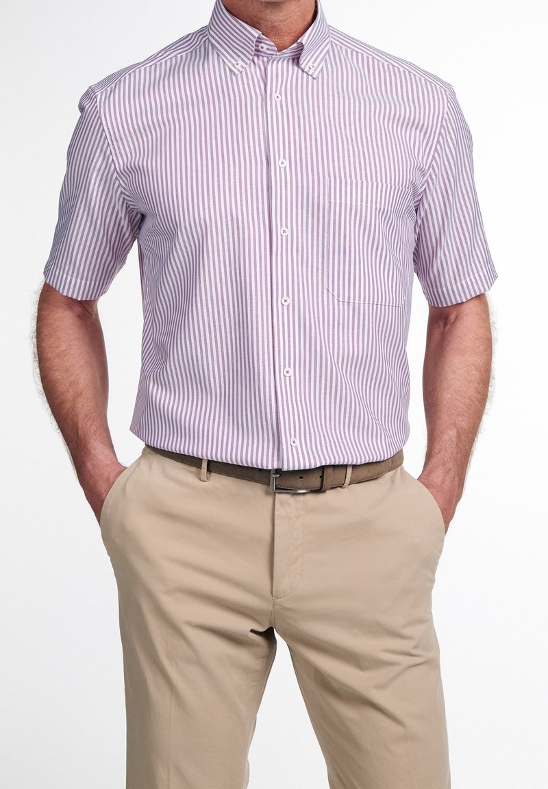 Short-sleeve button-up shirt in light purple and white stripes, with a collar and single chest pocket, paired with beige trousers and a brown belt.