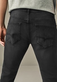 Next AUTHENTIC - Traperice suženog kroja - vintage black