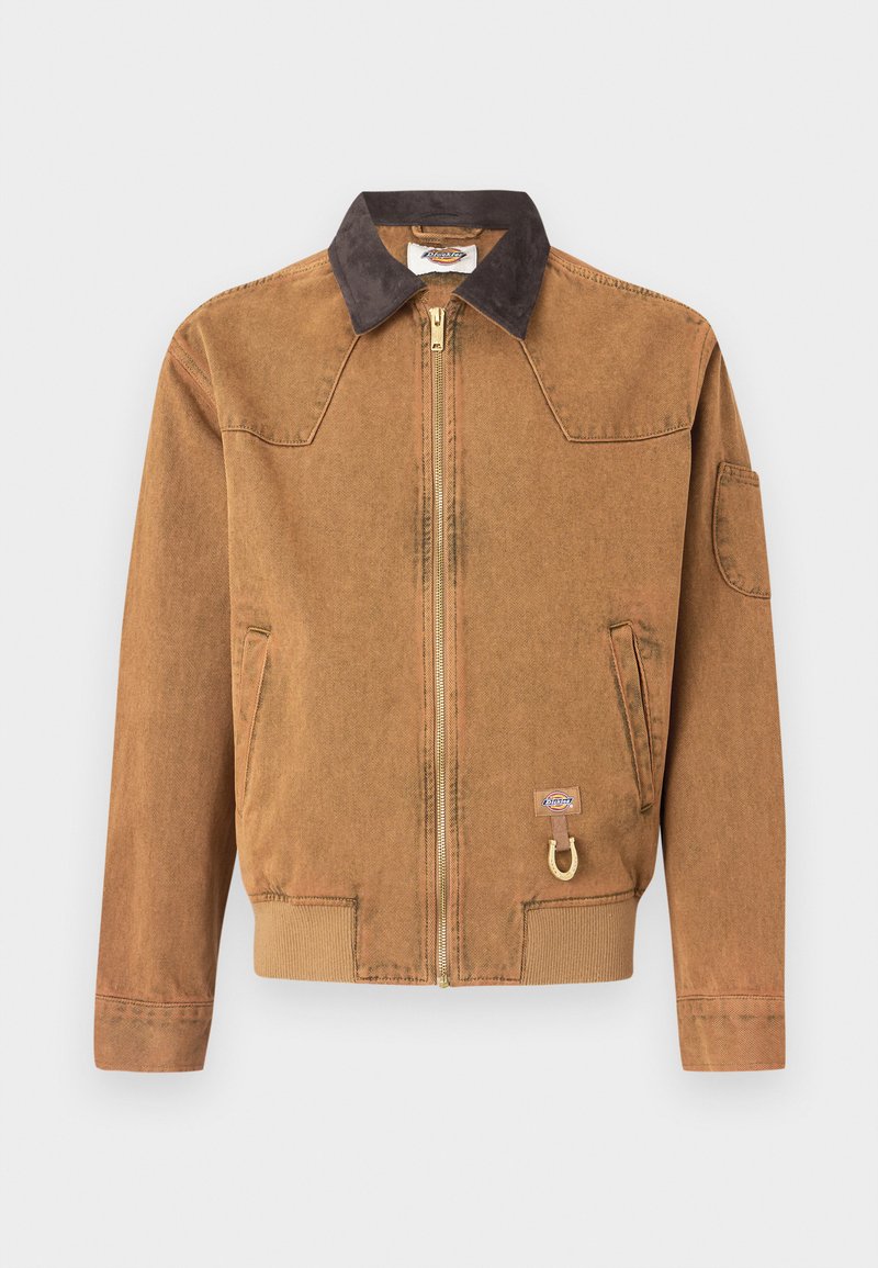 Brown denim jacket with a dark collar, front zipper, side pockets, and a gold-colored accent. Features a logo patch near the hem.