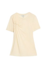 T-shirt giallo chiaro a maniche corte con un dettaglio annodato sul lato sinistro. Realizzato in tessuto morbido con una vestibilità rilassata e scollatura a girocollo.