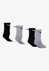 Šest párů sportovních ponožek v černé, bílé a šedé barvě. Bavlněný materiál, délka ke kotníkům, žebrovaný vzor, na každé ponožce malý černý logo Nike.