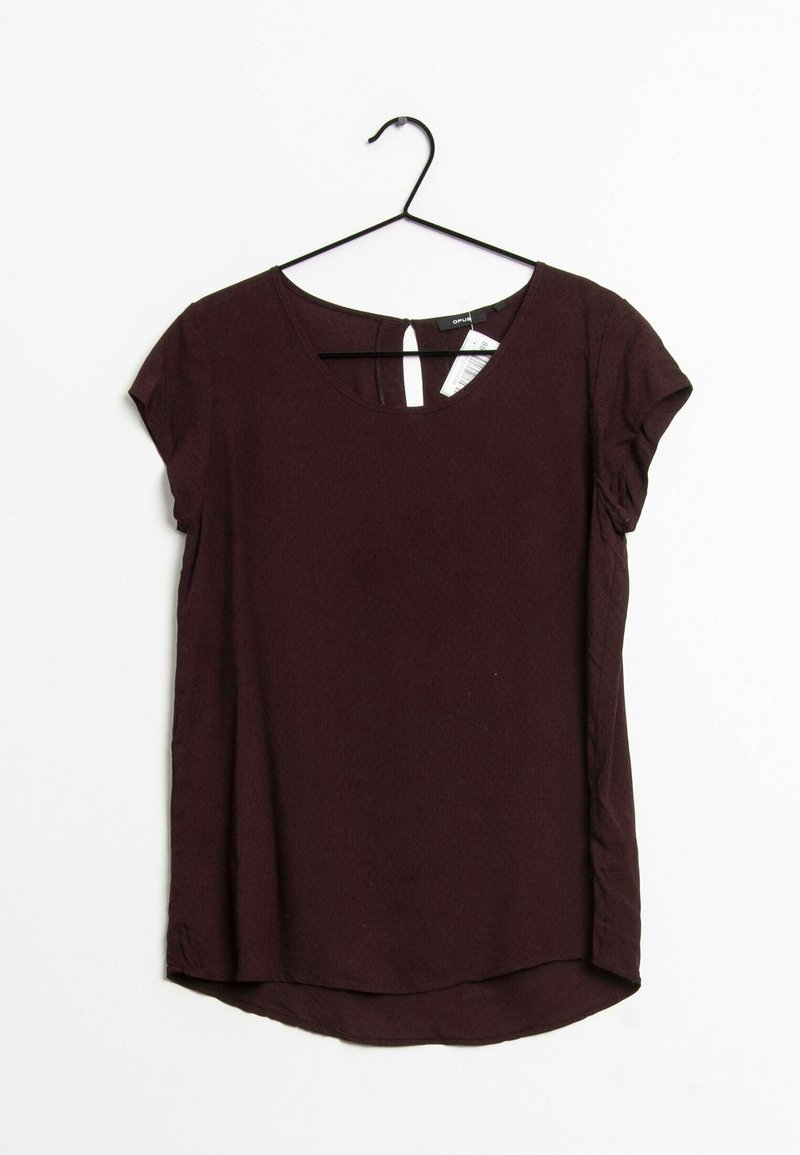 Burgundy short-sleeve top with a rounded neckline, back keyhole opening, and a slightly curved hem. Made from a smooth, lightweight fabric.