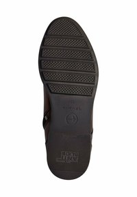 Semelle en caoutchouc noir avec des motifs de grip texturés, présentant la marque "Anti-Slide". Tige en cuir marron avec un détail de couture diagonale sur le côté.