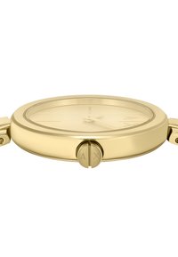 Orologio dorato con cassa rotonda, lunetta liscia, quadrante minimalista e due pulsanti con logo 'AX' inciso.