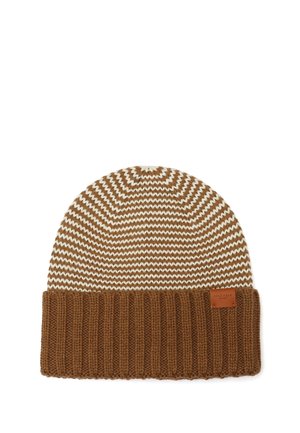 Bonnet tricoté marron et blanc à motif zigzag, avec un large bord-côte marron épais et une petite étiquette en cuir sur le bord.