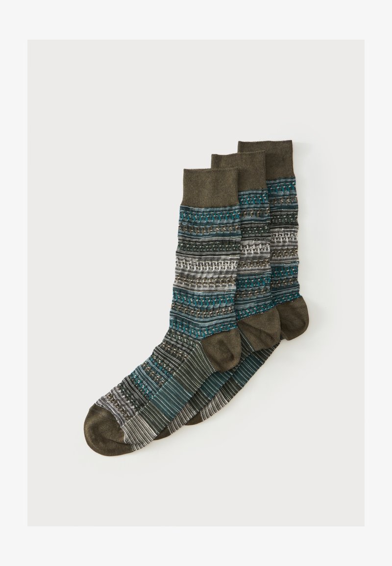 Trois chaussettes marron et bleu sarcelle à motif, longueur mi-mollet, empilées sur un fond blanc.
