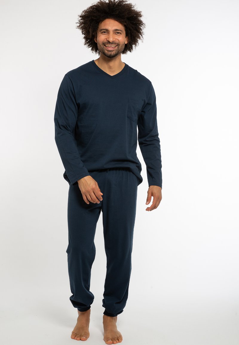 Navy-blaue, langärmelige V-Ausschnitt-Pyjama-Set aus weichem Stoff, mit einer Brusttasche und schmal zulaufenden Hosen mit elastischen Bündchen.