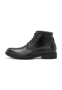 Botas de tobillo de cuero negro con un acabado suave, con un diseño de cordones, punta redonda y un tacón bajo cuadrado.