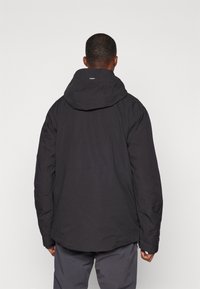 Black hooded jacket with a relaxed fit, featuring textured fabric and side pockets. The back shows a logo tag on the collar.