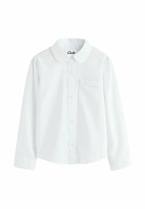 Hvid langærmet skjorte med knaplukning og kravehals, en lille brystlomme og puffede skuldre. Stoffet ser glat og let ud.