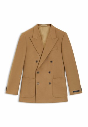 Dobbeltradet blazer i kamelfarvet uld, med spidse revers, to forlommer og mørke knapper. Foret indvendigt med diskret branding.