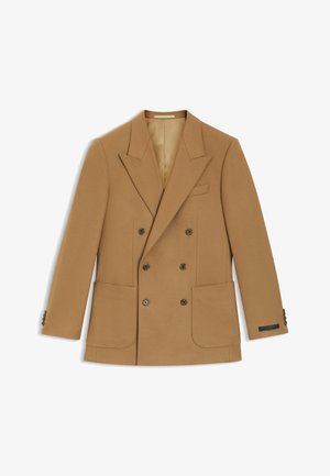 Double-breasted blazer van camel-kleurige wol, met punten revers, twee voorzakken en donkere knopen. Gevoerde binnenkant met subtiele branding.