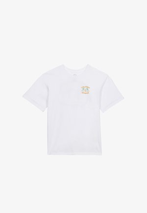 T-shirt blanc à manches courtes avec un petit logo jaune et vert "Volcom Stone" sur le côté gauche de la poitrine.