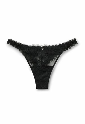 Tanga de encaje negro con patrón floral, paneles de malla y delicados bordes rizados. Presenta un pequeño detalle decorativo en la parte trasera.