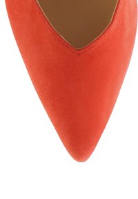 Red suede high-heeled shoe featuring a pointed toe and a v-cut design, with a smooth texture and minimalist style.