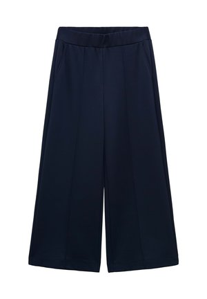 Marinefarbene weit geschnittene Hose mit glatter Textur, gefaltetem Frontbereich, elastischem Bund und seitlichen Taschen. Keine sichtbaren Muster oder Beschläge.