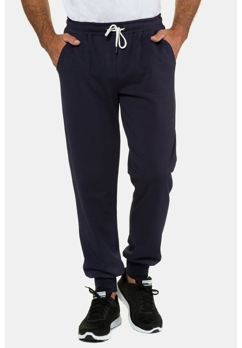 Marineblaue Jogginghosen aus weichem Material, mit einem elastischen Bund und Kordelzug, Seitentaschen und gerippten Manschetten.