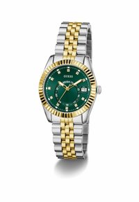 Montre argent et or avec un cadran vert, dotée d'index horaires en diamant, d'un affichage de date et d'un bracelet en métal bicolore.