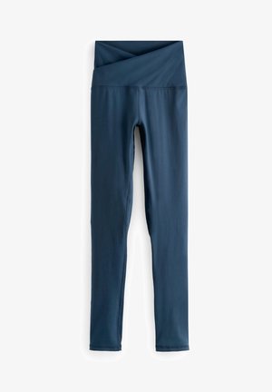 Leggings azul marino de cintura alta con cintura doblada, mostrados planos sobre un fondo blanco.