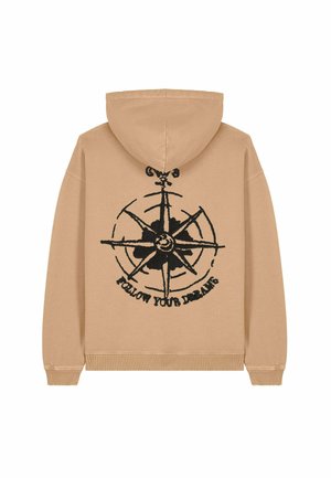 Felpa beige con grafica di una bussola nera e la scritta "SEGUITI I TUOI SOGNI." Progettata con un cappuccio regolabile e maniche a costine.