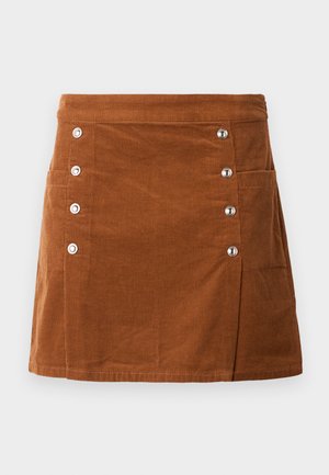 Brown corduroy skirt with a fitted waist, five metallic buttons on the left side, and two front pockets. Smooth texture with vertical ribbing.