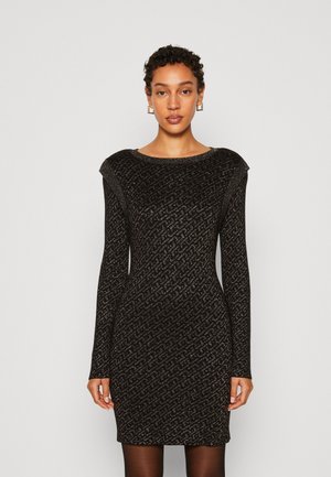 Abito lungo nero con maniche lunghe, con un motivo testurizzato, silhouette aderente e scollatura rotonda. Il tessuto presenta un leggero luccichio.
