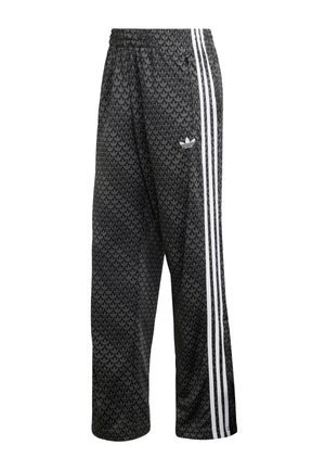 Μαύρο αθλητικό παντελόνι από πολυεστέρα με υφασμένο σχέδιο, με λευκές ρίγες στα πλάγια και ένα μικρό λογότυπο μπροστά. Ελαστική μέση.