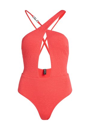 Coral one-piece swimsuit with crossed shoulder straps, textured fabric, low back cut, and slim fit, featuring a brand label at the back.