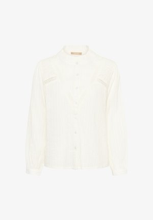 Bijela košulja dugih rukava s uspravnim ovratnikom, kopčanjem na gumbe, vertikalnim prugama i čipkastim detaljima na prsima. Teksturirani pamučni materijal.